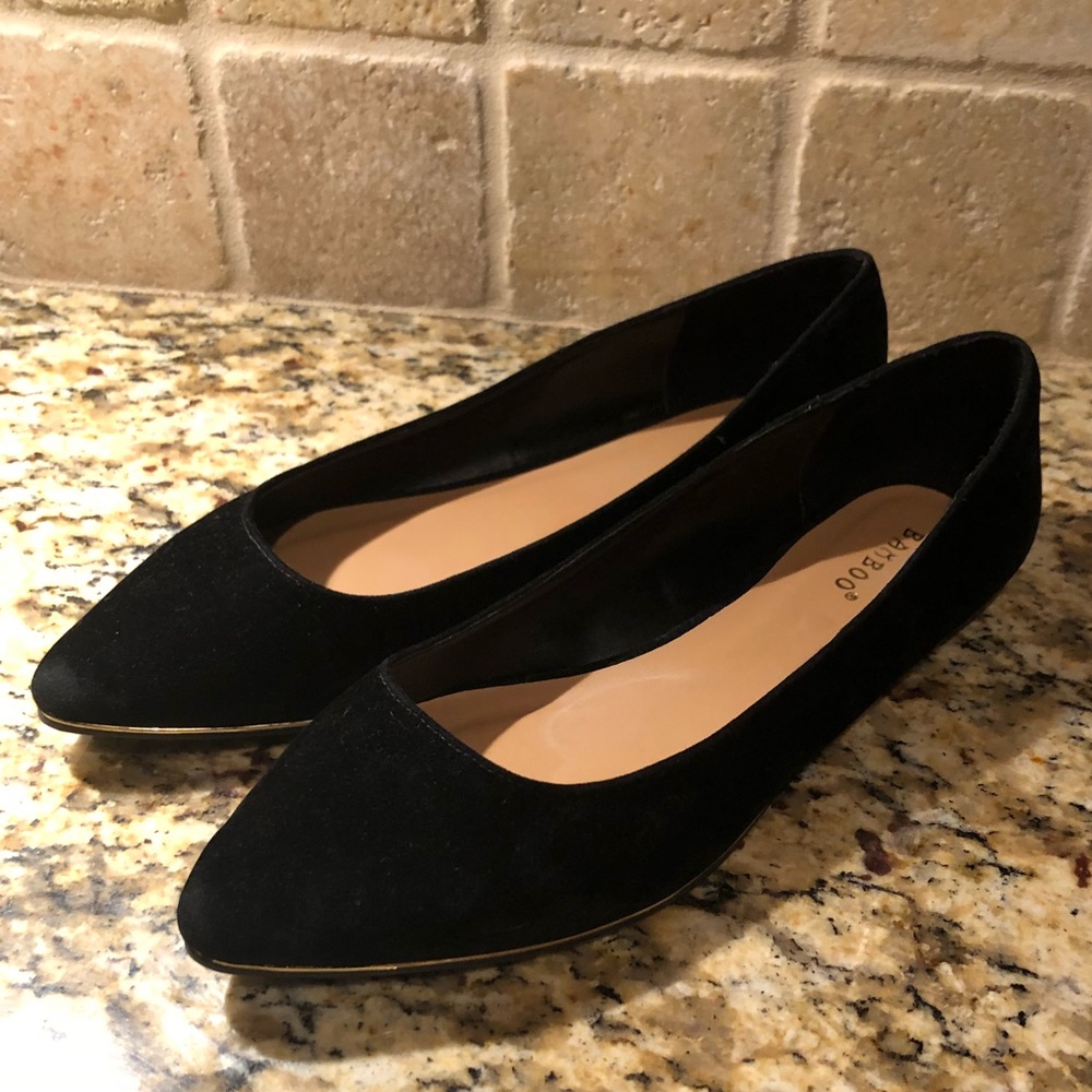 Black suede point toe flats